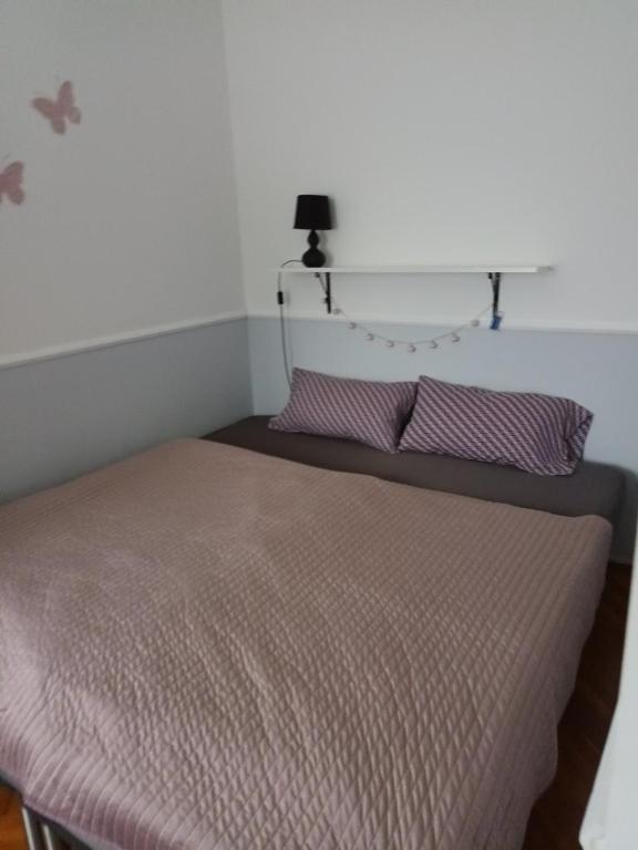 Łóżko lub łóżka w pokoju w obiekcie Viola Apartmanház