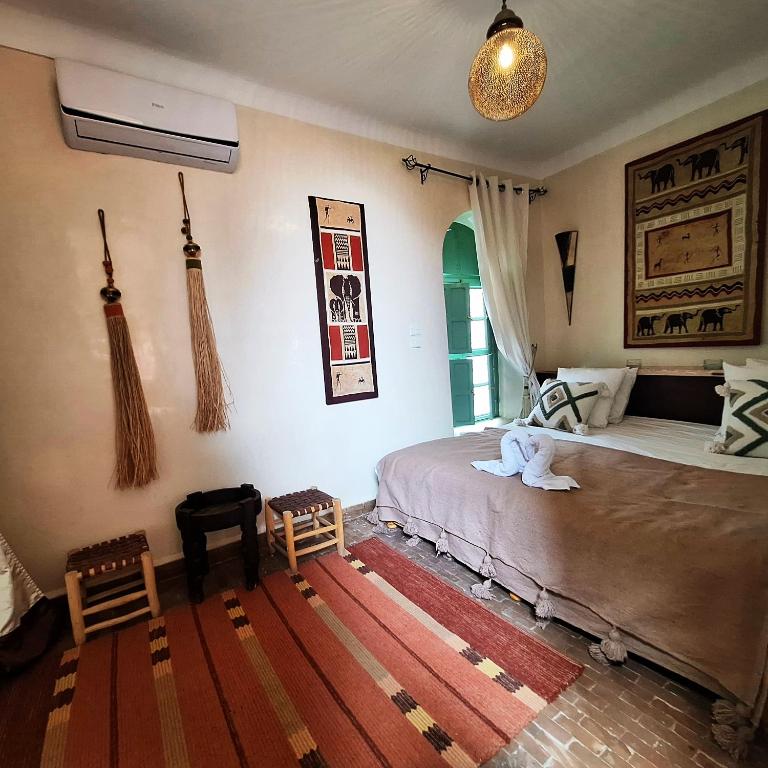 Postel nebo postele na pokoji v ubytování Riad El Grably