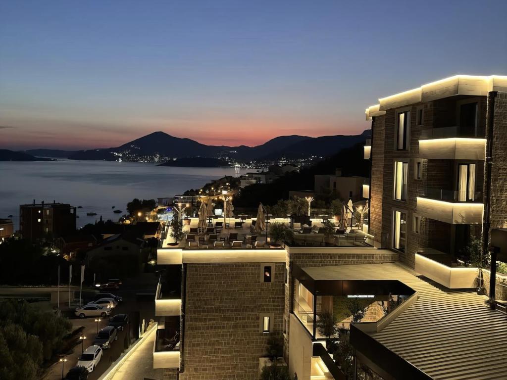 a view of a city with a view of the water at Regent Resort Budva in Budva