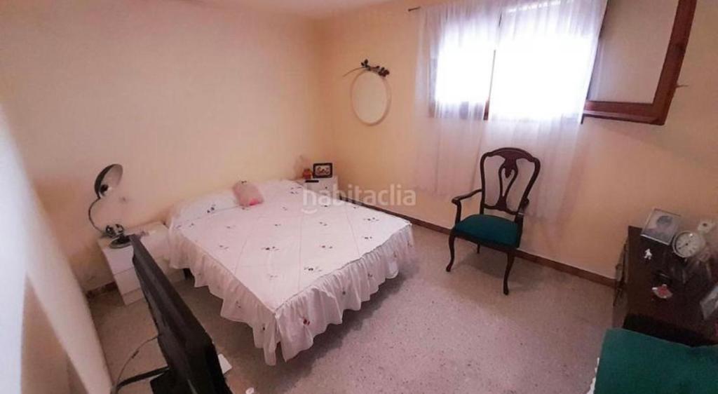 Ένα ή περισσότερα κρεβάτια σε δωμάτιο στο Casa unifamiliar