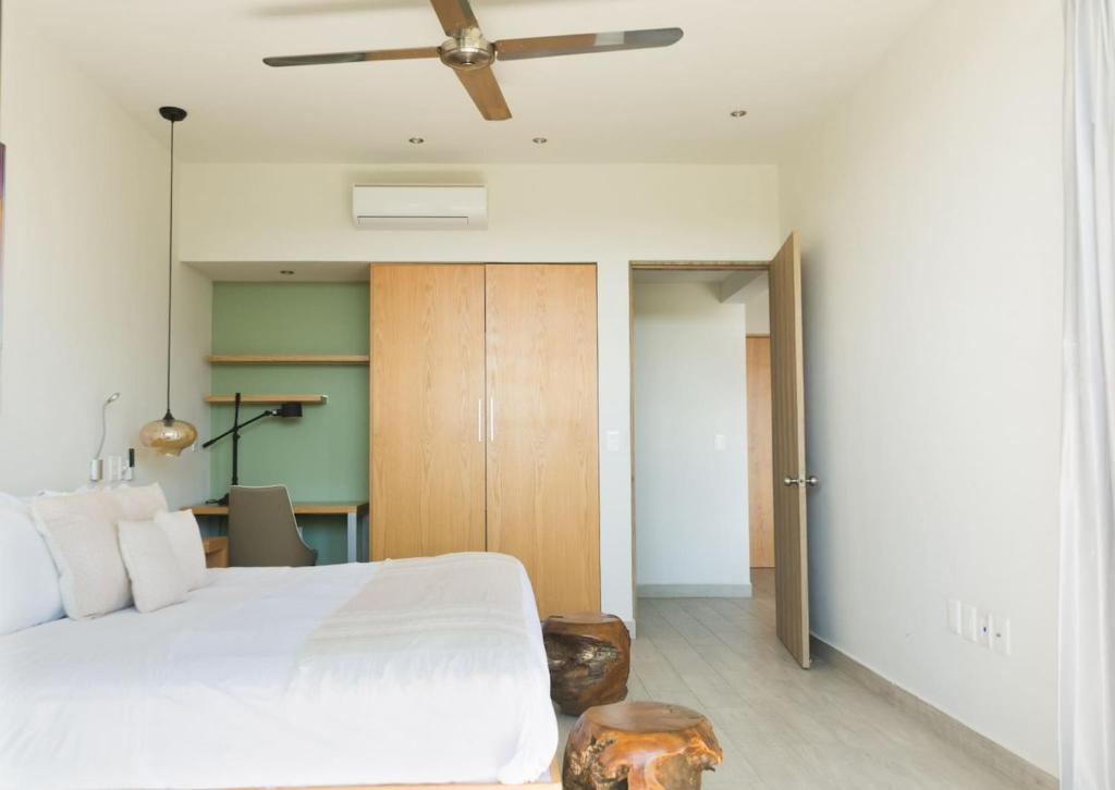 Postel nebo postele na pokoji v ubytování Opal Suites Apartments