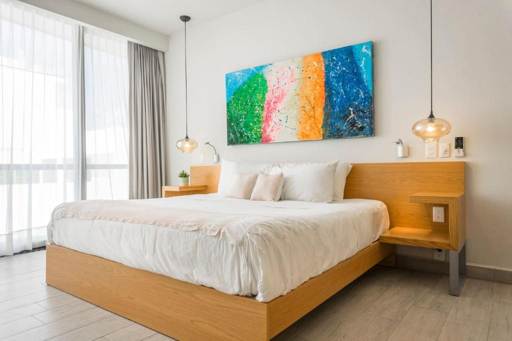 Postel nebo postele na pokoji v ubytování Opal Suites Apartments