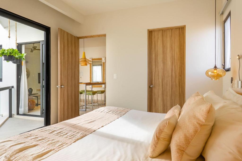 Postel nebo postele na pokoji v ubytování Opal Suites Apartments