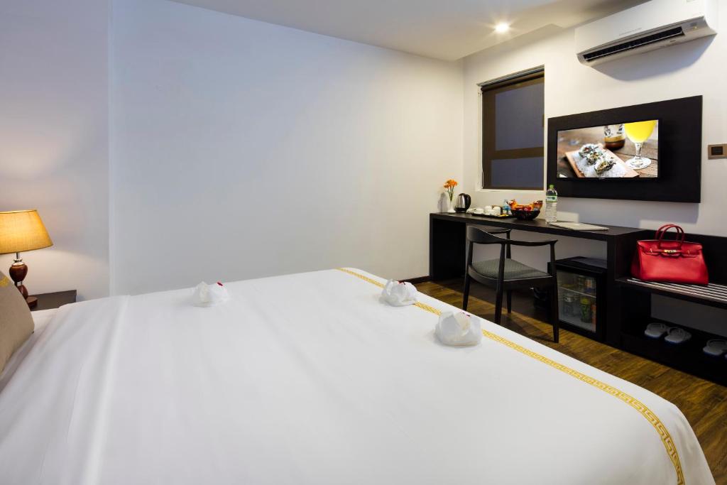 Postel nebo postele na pokoji v ubytování Meriton Hotel Nha Trang