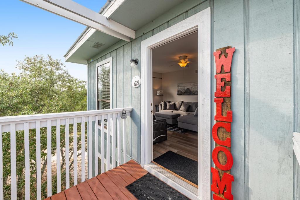 a front door of a house with a porch at Romar Village 621 in Orange Beach