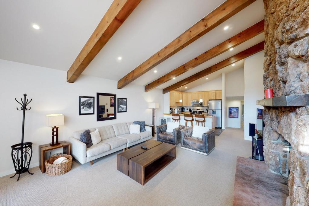a living room with a couch and a table at Beaver Creek West 22 in Avon