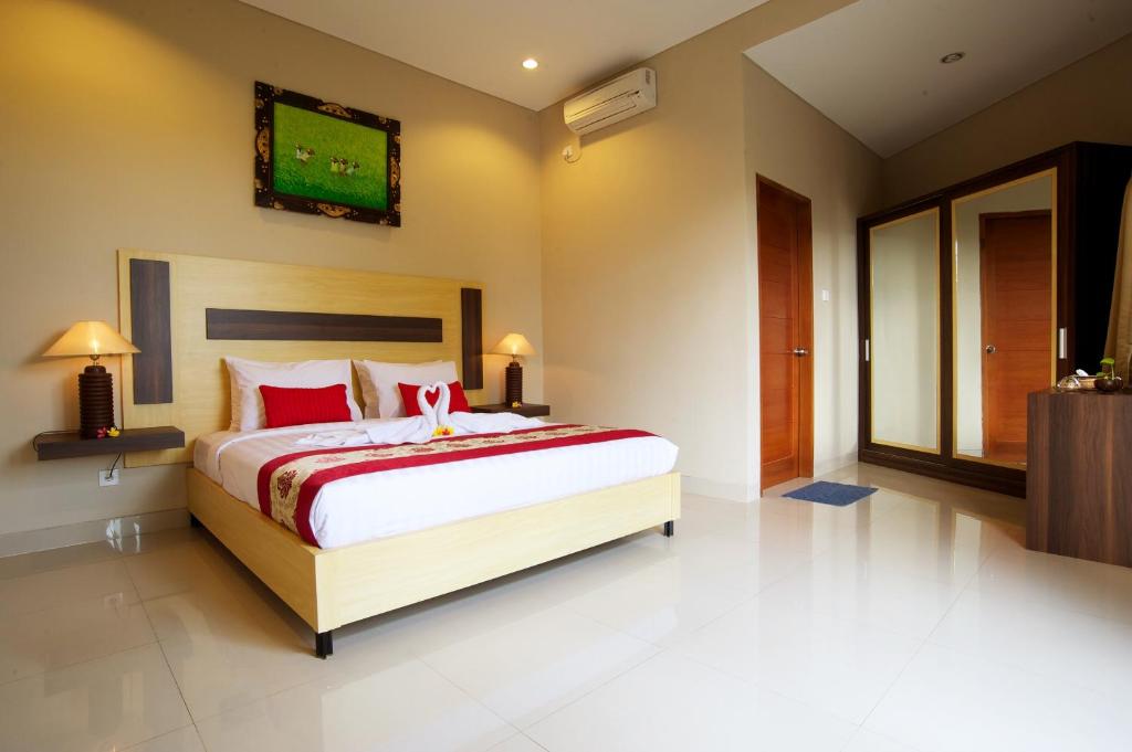 Postel nebo postele na pokoji v ubytování Saka Village Resort Ubud