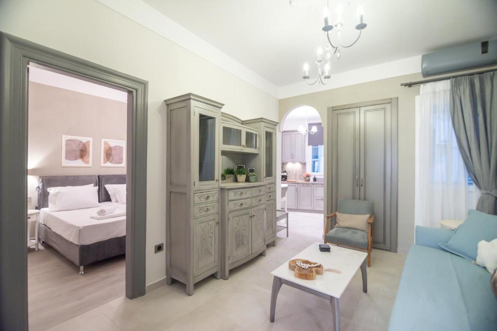 a bedroom with a bed and a table and a mirror at To Spitaki in Thessaloniki
