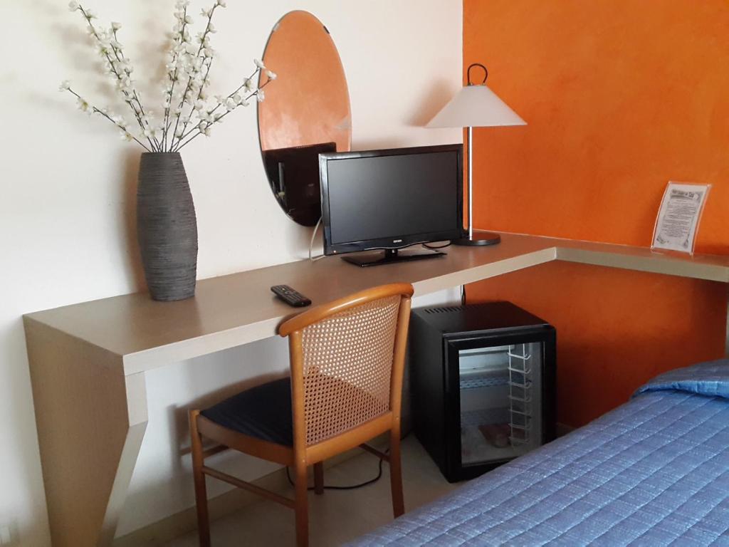 TV a/nebo společenská místnost v ubytování Cavalieri del Tau