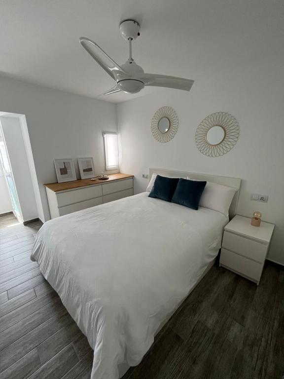 Postel nebo postele na pokoji v ubytování Candela Apartamento