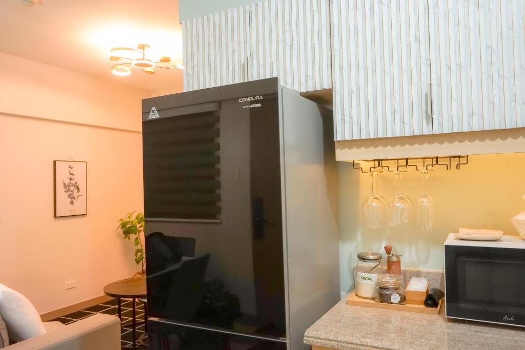Een keuken of kitchenette bij Alea Residences