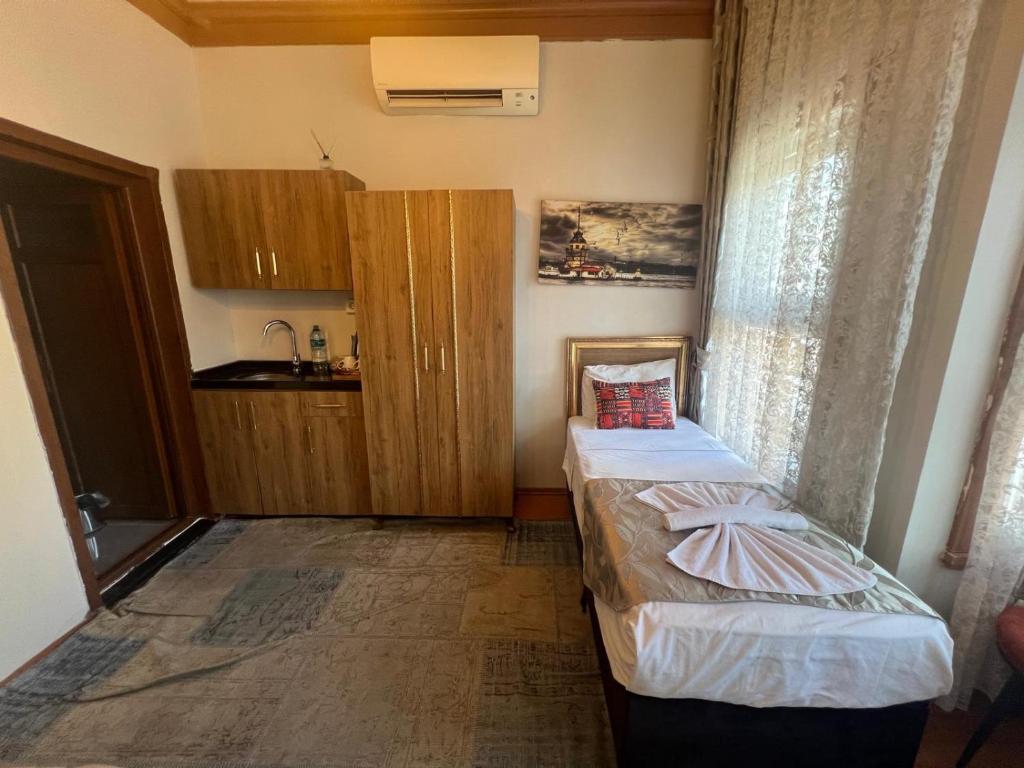 Postel nebo postele na pokoji v ubytování April Story Apart Hotel