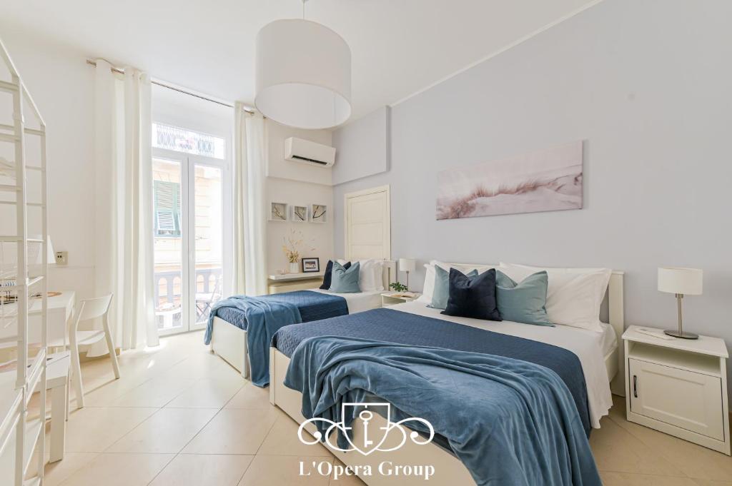 Ένα ή περισσότερα κρεβάτια σε δωμάτιο στο Mare e Teatro Apartment - L'Opera Group