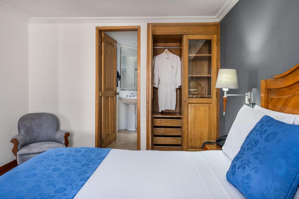 Postel nebo postele na pokoji v ubytování Hotel Egina Bogotá