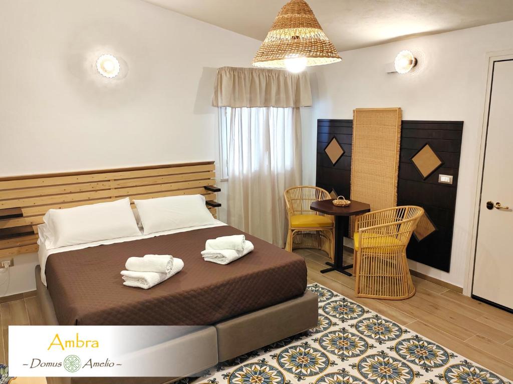 Postel nebo postele na pokoji v ubytování Domus Amelio - Country Rooms