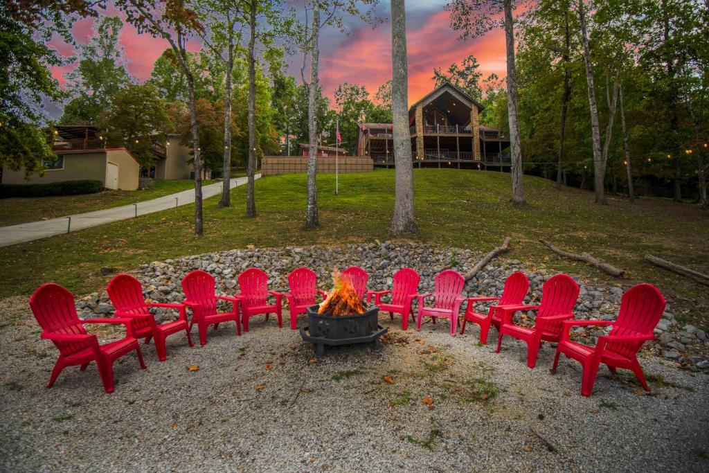 a group of red chairs around a fire pit at Nor Largo in Grantsboro