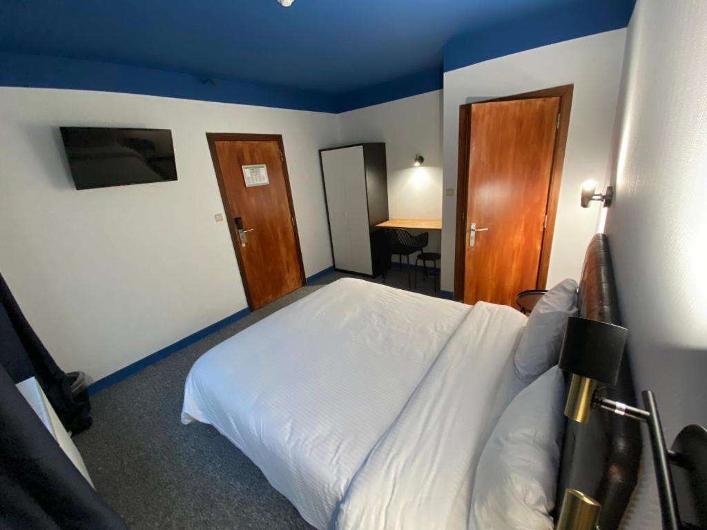 Postel nebo postele na pokoji v ubytování Hotel Windsor