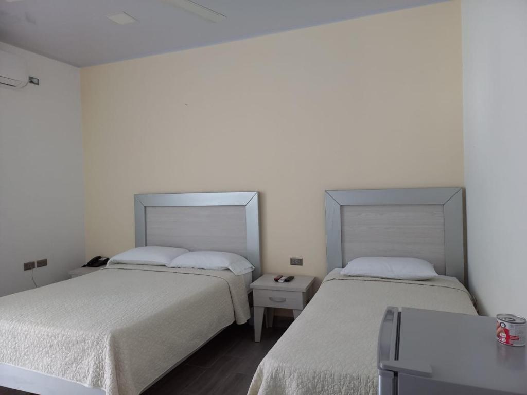 Postel nebo postele na pokoji v ubytování Cabañas La Palma