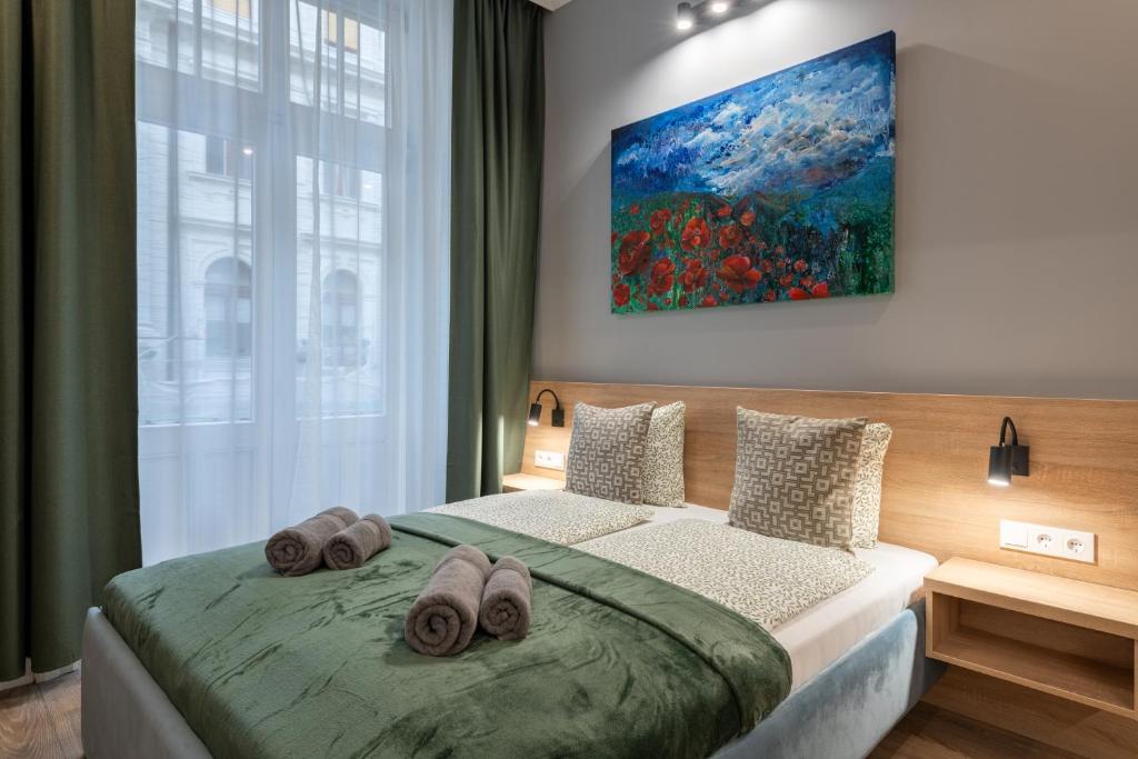 Posteľ alebo postele v izbe v ubytovaní Budapest Holidays Downtown