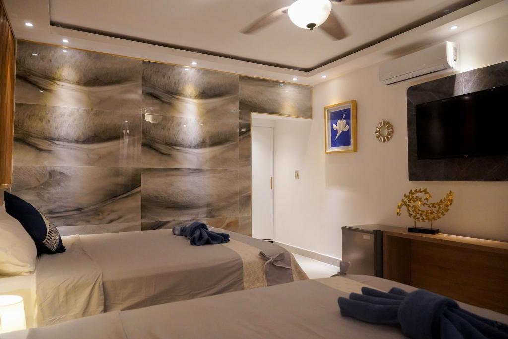 Postel nebo postele na pokoji v ubytování Soficu Hotel on the beach bayahibe