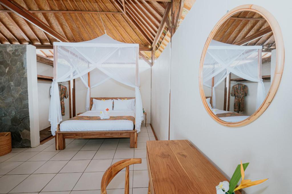Postel nebo postele na pokoji v ubytování Bali Hai Island Resort Jembrana