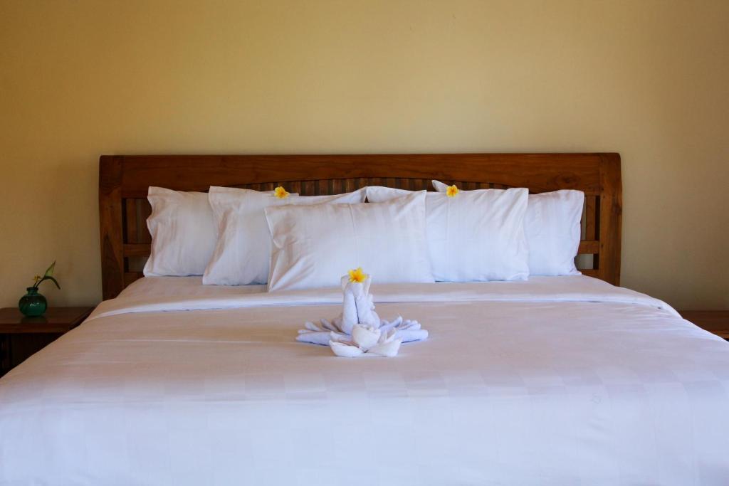 Postel nebo postele na pokoji v ubytování Bali Hai Island Resort Jembrana