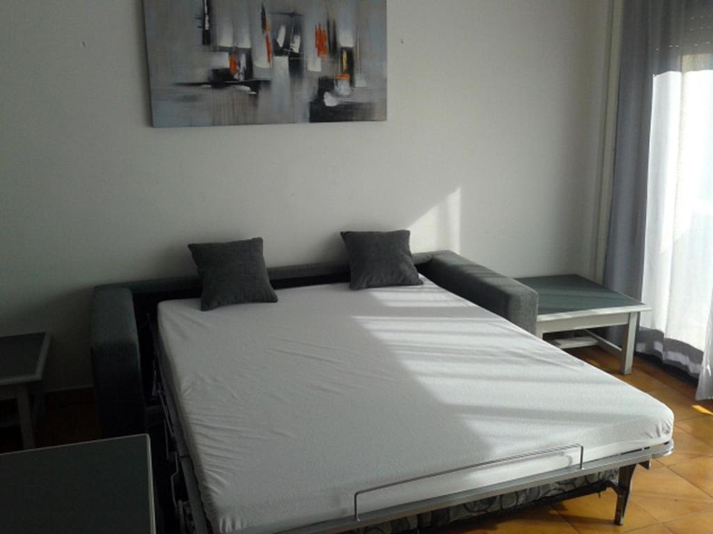 Postel nebo postele na pokoji v ubytování Residencial Super Stop Palafrugell