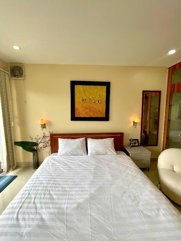 Postel nebo postele na pokoji v ubytování Hoa Ngoc Lan - The Orchid Villa Dalat