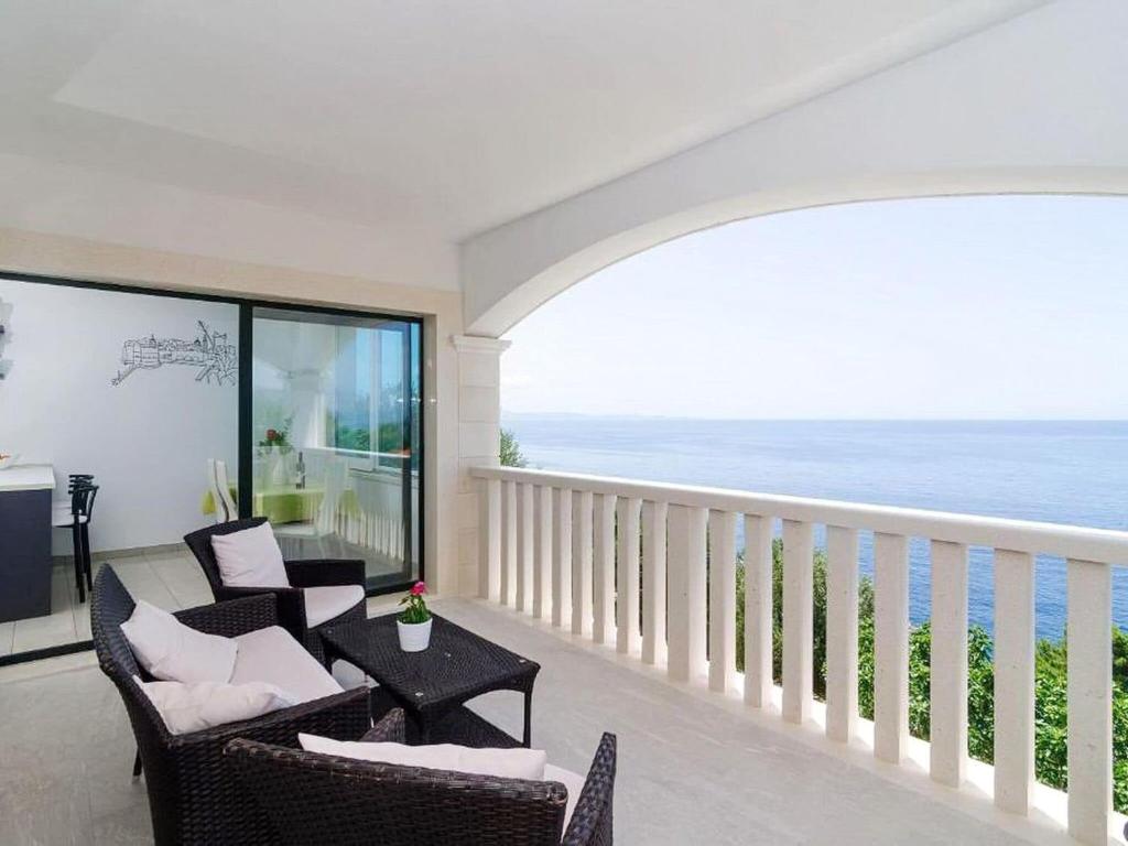 a living room with a view of the ocean at Apartments Villa Bella Vista - Two Bedroom Apartment with Balcony and Sea View in Potomje