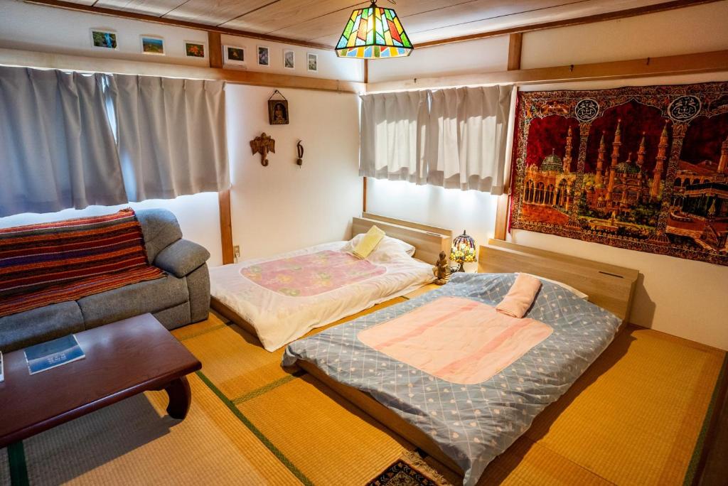 Postel nebo postele na pokoji v ubytování Rishiri Antique Inn