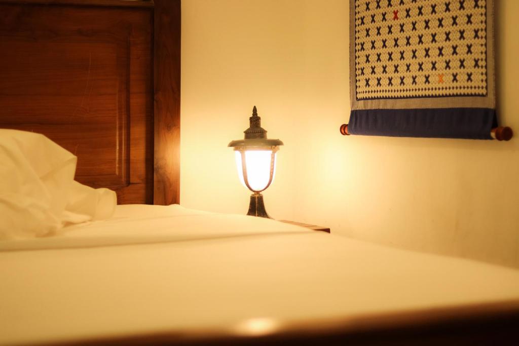 Postel nebo postele na pokoji v ubytování La Maison de Trinco