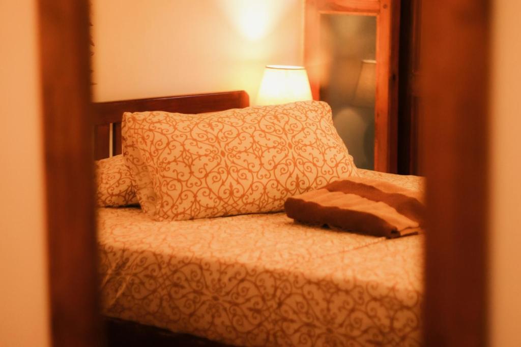 Postel nebo postele na pokoji v ubytování La Maison de Trinco