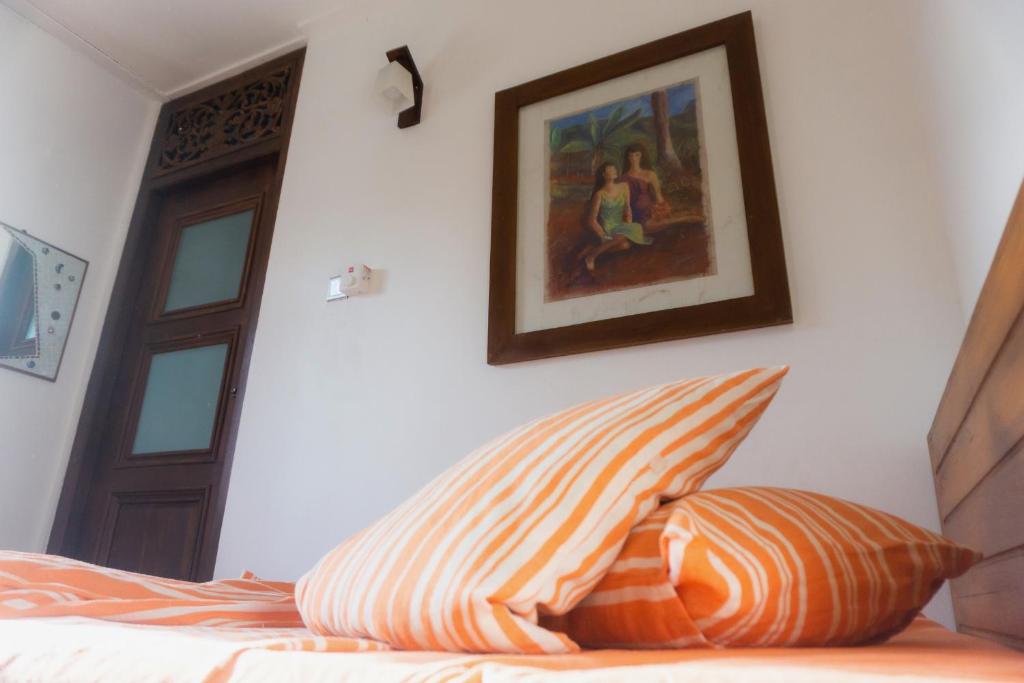 Postel nebo postele na pokoji v ubytování La Maison de Trinco