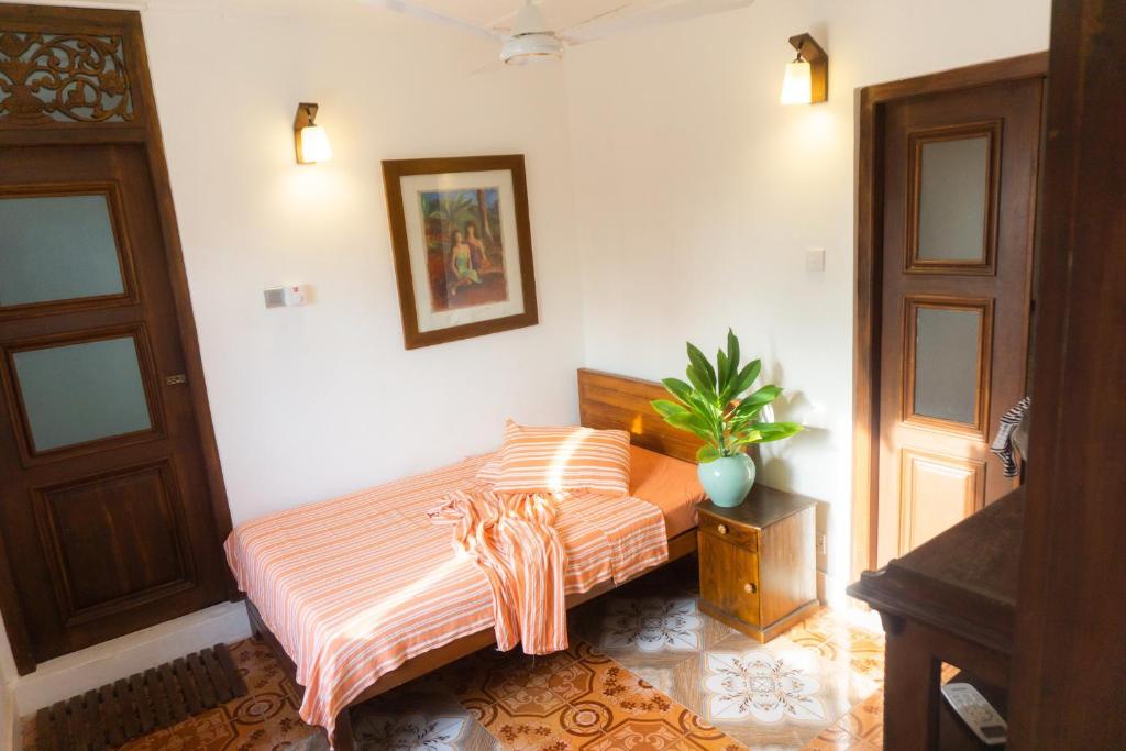 Postel nebo postele na pokoji v ubytování La Maison de Trinco