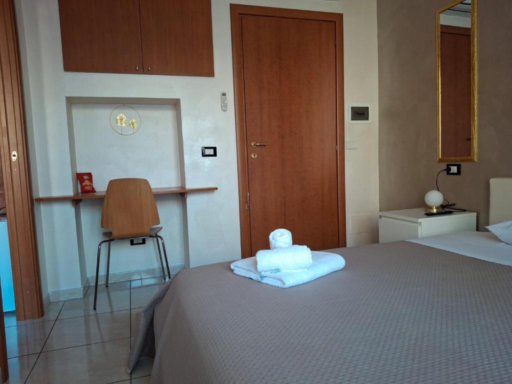 Postel nebo postele na pokoji v ubytování B&B Da Rocco