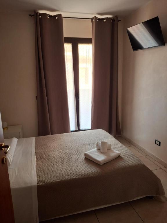 Postel nebo postele na pokoji v ubytování B&B Da Rocco