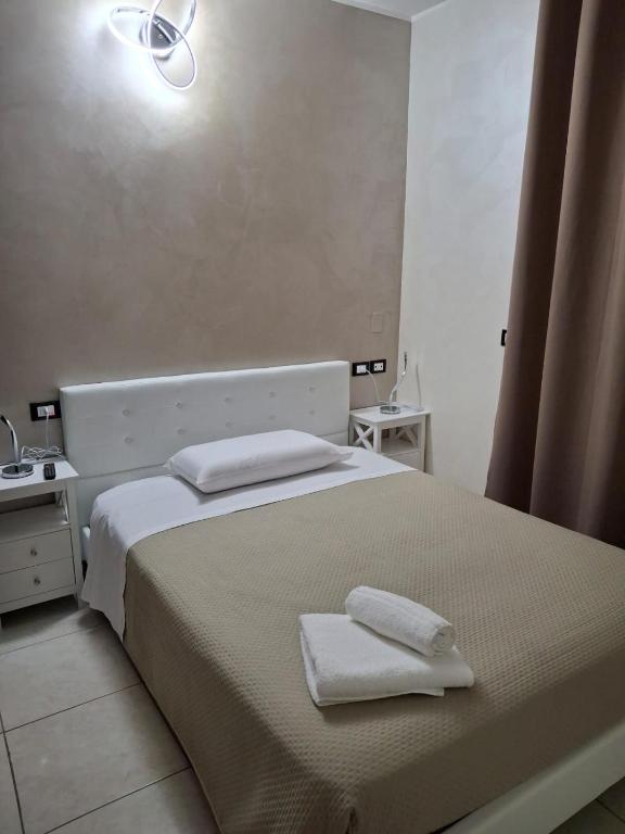 Postel nebo postele na pokoji v ubytování B&B Da Rocco