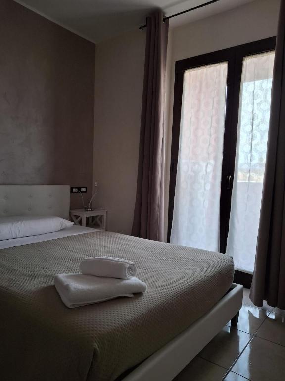 Postel nebo postele na pokoji v ubytování B&B Da Rocco
