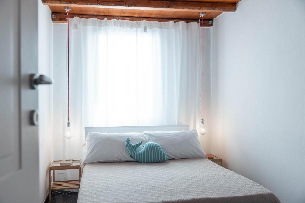 Postel nebo postele na pokoji v ubytování A Casa di Elena