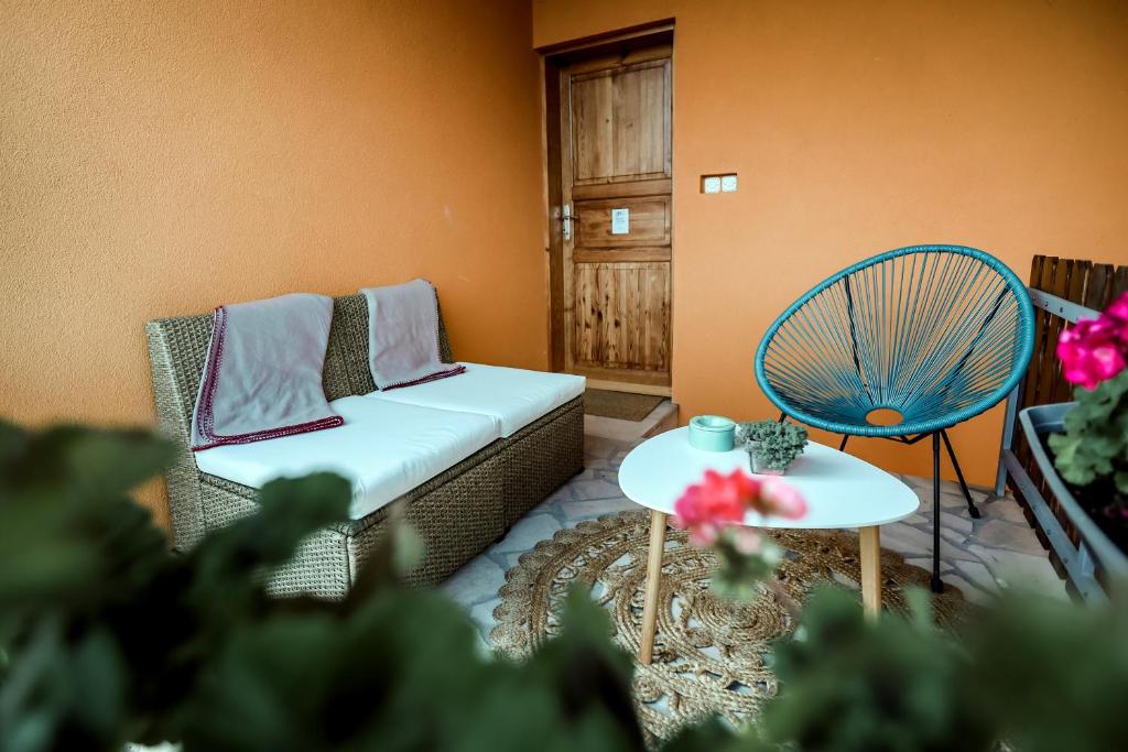 a living room with a couch and a table at Kuća za odmor Duga in Šušnjevci