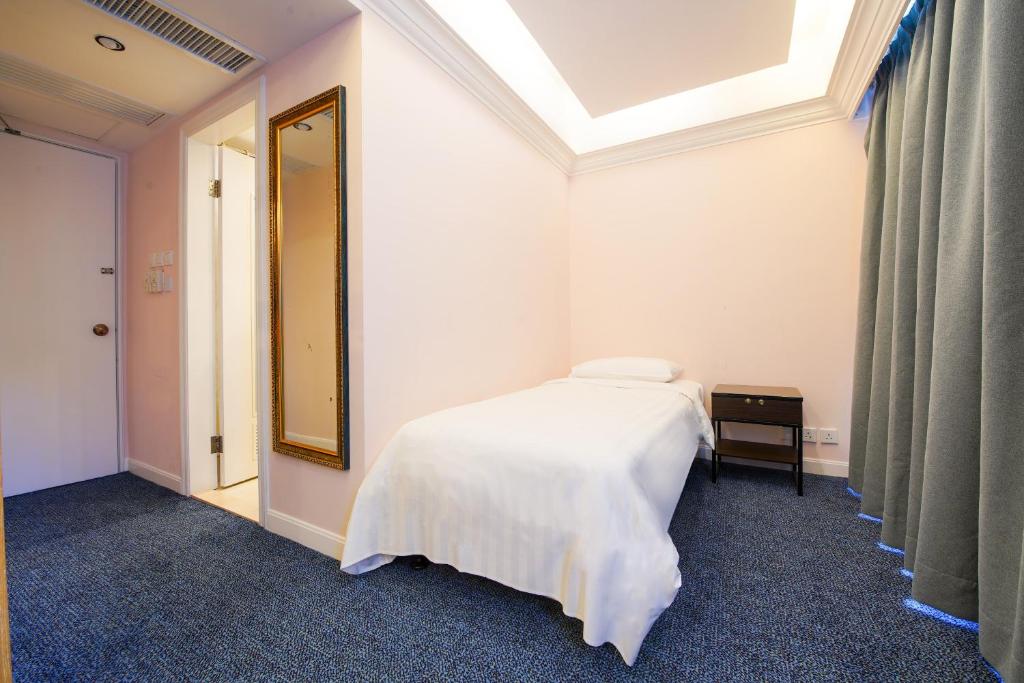 Ein Bett oder Betten in einem Zimmer der Unterkunft Warwick Hotel Cheung Chau