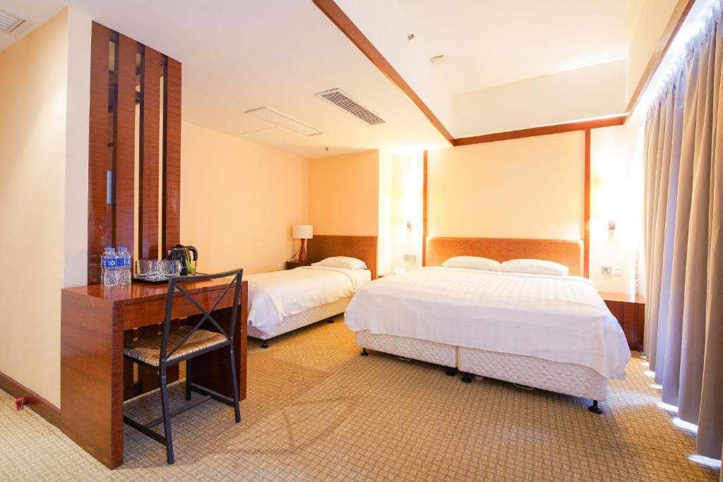 Ein Bett oder Betten in einem Zimmer der Unterkunft Warwick Hotel Cheung Chau
