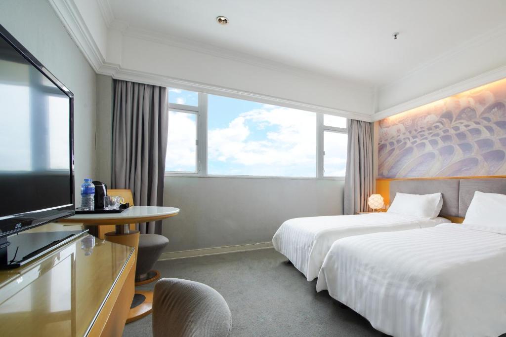 Ein Bett oder Betten in einem Zimmer der Unterkunft Warwick Hotel Cheung Chau