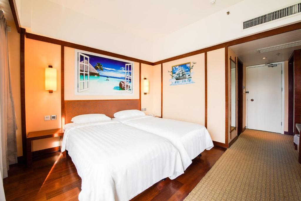 Ein Bett oder Betten in einem Zimmer der Unterkunft Warwick Hotel Cheung Chau