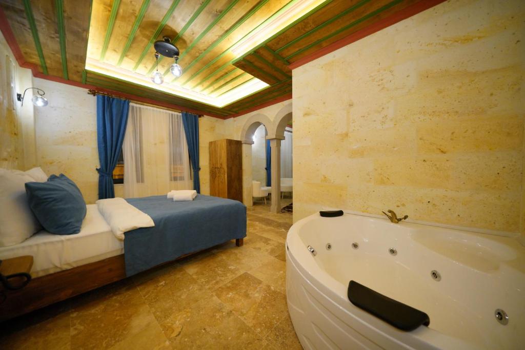 Postel nebo postele na pokoji v ubytování Mayda Cappadocia