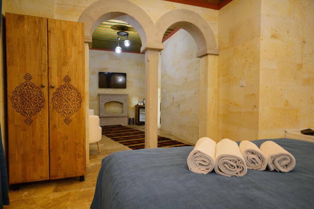 Postel nebo postele na pokoji v ubytování Mayda Cappadocia