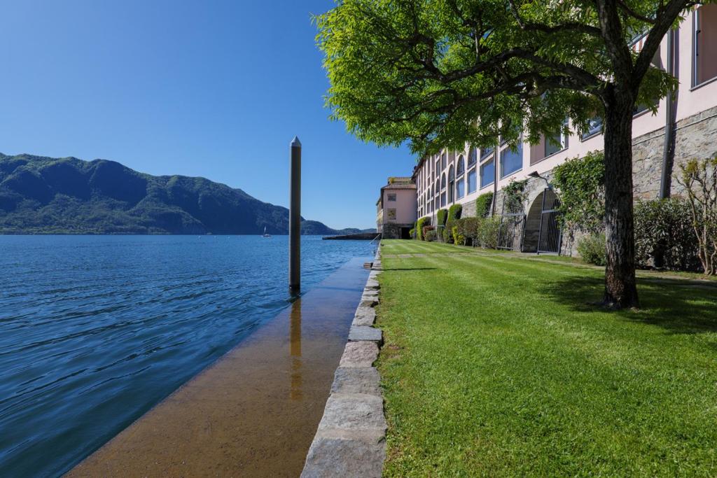 a building next to a body of water at Yachting Residence in Ghiffa