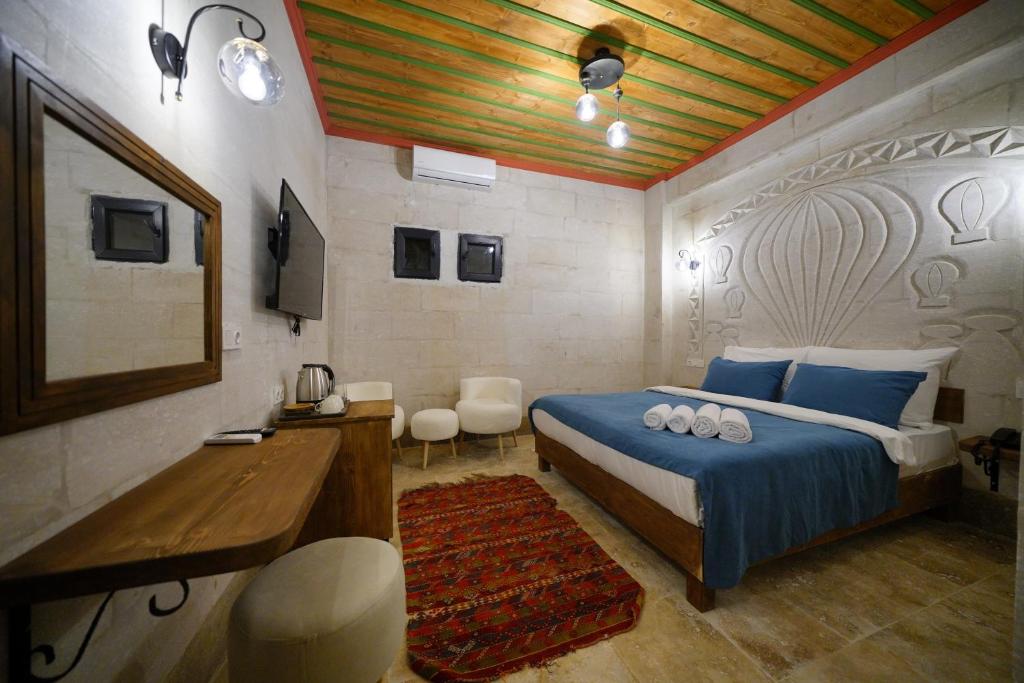 Postel nebo postele na pokoji v ubytování Mayda Cappadocia