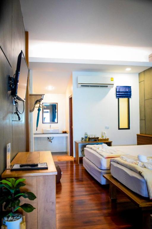Postel nebo postele na pokoji v ubytování Salakphet Resort