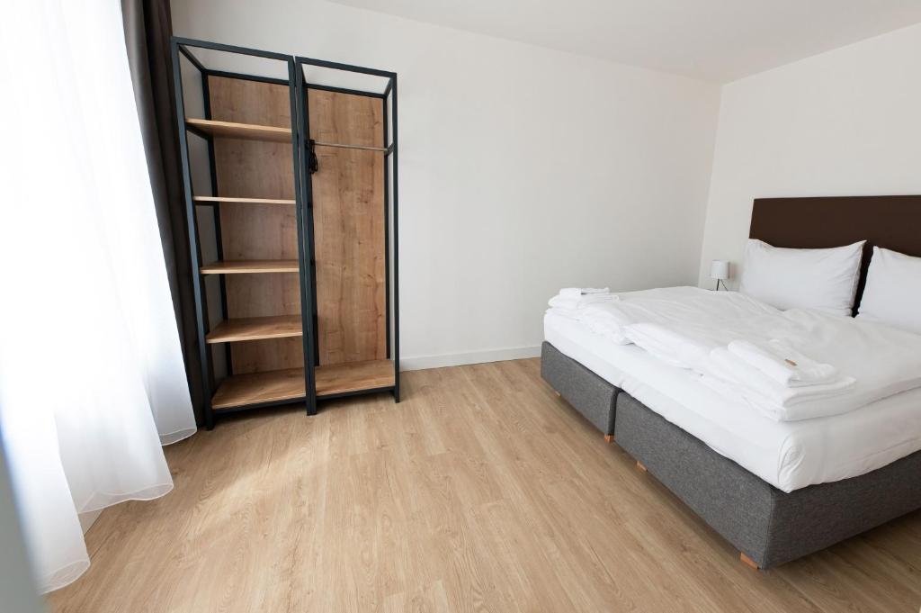 Postel nebo postele na pokoji v ubytování Post 120 Suites